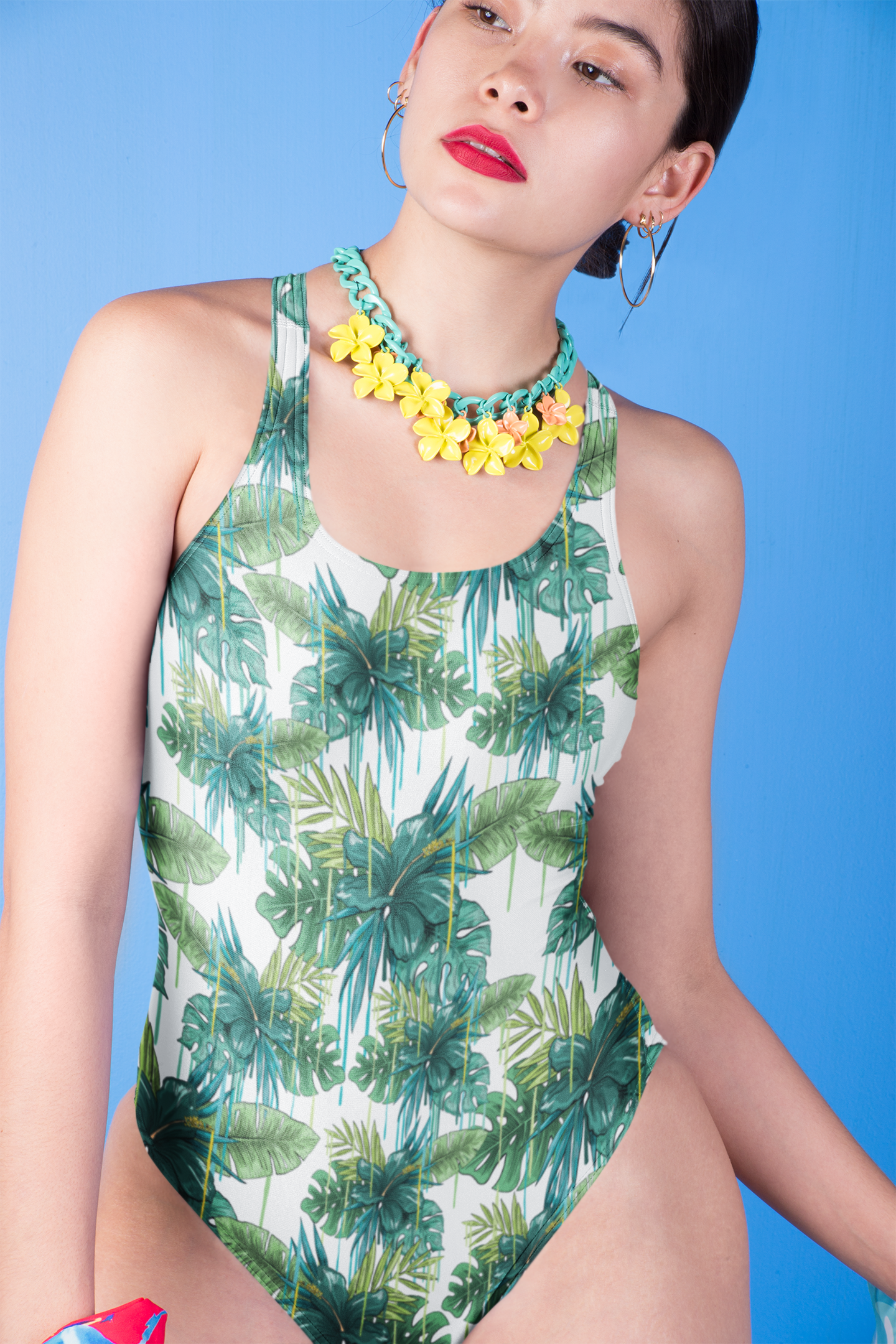Woman-wearing-an-Aerene-swimsuit-and-a-flowers-necklace